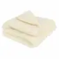 Folded ivory merino wool blanket with a soft, textured finish.