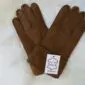 A pair of brown suede kids sheepskin gloves with visible stitching and a white product tag.