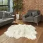 Hide Rugs_Lifestyle_0003 Large ivory Icelandic sheepskin rug with long, thick wool on a wooden floor.