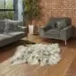 Hide Rugs_Lifestyle_0016 A light grey Icelandic double sheepskin rug with long, thick wool on a wooden floor.