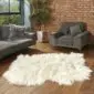 Hide Rugs_Lifestyle_0037 Large ivory Icelandic sheepskin rug with long, thick wool and natural organic edges on a wooden floor.