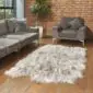 Large linen-coloured Icelandic sheepskin rug with long, thick wool and natural shaped edges on a wooden floor.