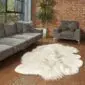 Large, multi-layered white Icelandic sheepskin rug with long, shaggy wool and natural irregular edges.