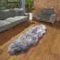 Hide Rugs_Lifestyle_0521 Long double Icelandic sheepskin rug with shorn grey and white wool on a wooden floor.