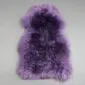 IMG_0109 A thick, purple sheepskin rug with long, textured wool fibres in a natural pelt shape.