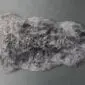 Grey shorn Icelandic sheepskin rug with a natural organic shape and textured wool pile.