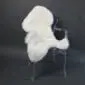 Ivory shorn Icelandic sheepskin rug with a thick, woolly texture laid flat.