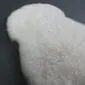 Ivory shorn Icelandic sheepskin rug with a thick, curly wool texture and natural organic shape.