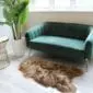 Long-haired Icelandic sheepskin rug in rusty brown and tan tones on a light floor.