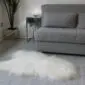 Ivory Icelandic sheepskin rug with long, shaggy wool and a natural organic shape.