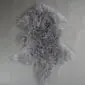 IMG_3504 Steel grey Mongolian lambskin rug with long, curly wool fibres and a natural hide shape.