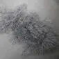 IMG_3509 Steel grey Mongolian lambskin rug with long, curly wool fibres.