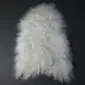 Small ivory Icelandic sheepskin rug with long, thick wool and natural organic shape.