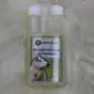 A clear plastic bottle of sheepskin shampoo and wool wash with a white cap, positioned .