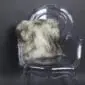 Long-haired Icelandic sheepskin cushion with cream wool and dark grey tips on a .