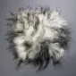 Long-haired Icelandic sheepskin pad with cream wool and dark grey tips.