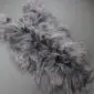 IMG_7775 Natural grey Icelandic sheepskin rug with long, shaggy wool fibres and an irregular organic shape.