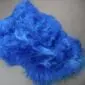 Long-haired Icelandic sheepskin rug in a vibrant cobalt blue colour with a natural, irregular shape.