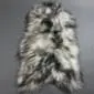 Long-haired Icelandic sheepskin rug with natural cream wool and dark grey to black tips.