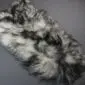 Long-haired Icelandic sheepskin rug with natural cream wool and dark grey to black tips. detail view