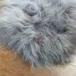 Long-haired grey Icelandic sheepskin rug with natural textured wool.