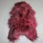 Burgundy red Icelandic sheepskin rug with long, thick wool and a natural hide shape.