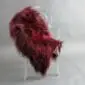 Long-haired burgundy red Icelandic sheepskin rug laid flat. detail view