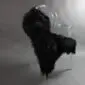 Long-haired black Icelandic sheepskin rug laid flat.