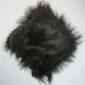 Square black Icelandic sheepskin cushion with long, shaggy wool fibres.
