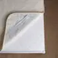 Mattress cover LUKA 02 2ply Ivory merino wool mattress topper with a double layer design and rounded corners.