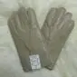 A pair of men's beige nappa leather gloves with visible stitching and a white brand label.