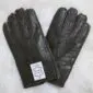 A pair of khaki green sheepskin nappa leather gloves with three stitched lines on the back.