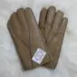 A pair of light brown sheepskin nappa leather gloves with visible stitching and a white brand label.