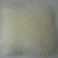 Square ivory Mongolian sheepskin cushion with long, curly wool texture.