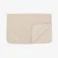 Rectangular beige merino wool kids blanket with rounded corners and a folded edge.