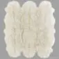 Rug-023 Large ivory sexto sheepskin rug with a thick, textured wool pile and natural scalloped edges.