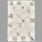 Rectangular patchwork rug made from shorn Icelandic sheepskin in cream, white, and grey tones.