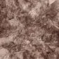 Rug-034a Close-up of a Paco sheepskin rug featuring thick, textured wool in mottled shades of brown and taupe.