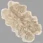 Large quad stone-coloured sheepskin rug with a thick, textured wool pile and natural scalloped edges.
