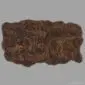 Large rectangular rare breed sheepskin rug with thick, dark brown curly wool and natural scalloped edges.