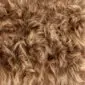 Close-up of rusty brown Icelandic sheepskin rug with long, wavy wool fibres.
