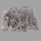 Large grey Icelandic sheepskin rug with long, thick wool and natural textured edges.