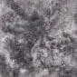 Rug-085a Close-up of a shorn Icelandic sheepskin rug in mottled grey and white tones with a dense, curly wool texture.