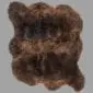 Rug-088 A large, double-length rare breed sheepskin rug with thick, textured wool in mottled shades of dark and light brown.
