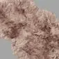 Double Paco sheepskin rug with long, thick dusky pink wool pile and natural curved edges.