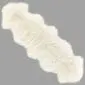 Long ivory double sheepskin rug with a thick, fluffy texture and natural scalloped edges.