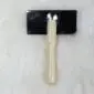 Sheepskin-Rug-Brush-03-1.jpg Sheepskin rug brush with a light wood handle and a rectangular black metal wire head.