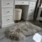 Long-haired Icelandic sheepskin rug in linen grey with a natural, shaggy texture.