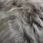 Close up of taupe Icelandic sheepskin rug showing long, thick, natural wool fibres.
