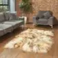 Hide Rugs_Lifestyle_0097 Large rusty grey Icelandic sheepskin rug with long, thick wool pile on a wooden floor.